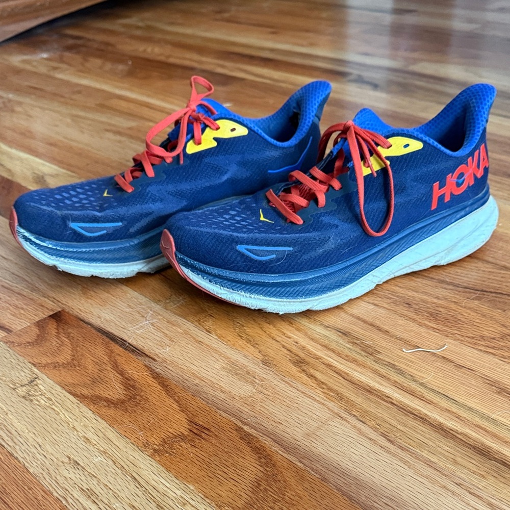Hoka Men's Navy Blue Running Shoes with Red Laces and Yellow Accents